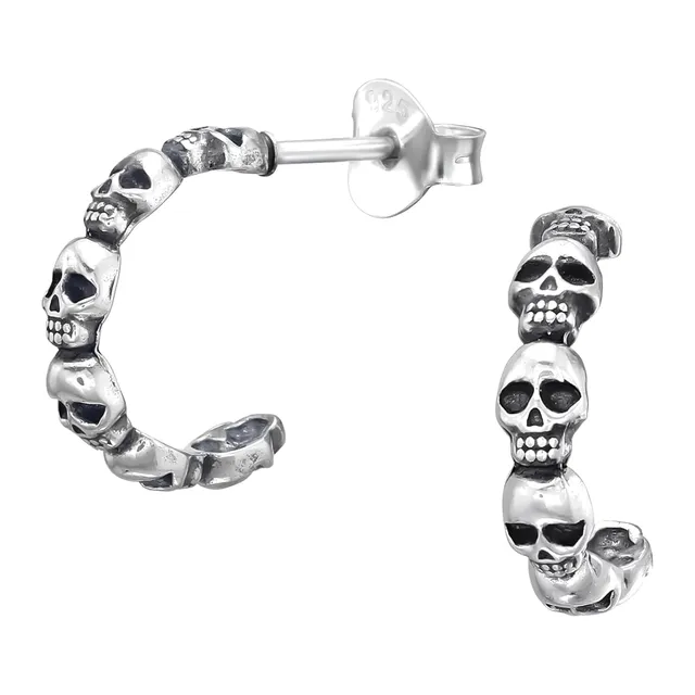 Pair of sterling silver half hoop earrings with small skull details