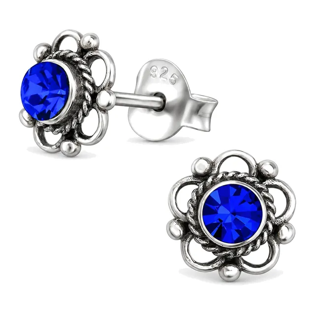 Pair of sterling silver flower stud earrings with blue sapphire coloured crystals